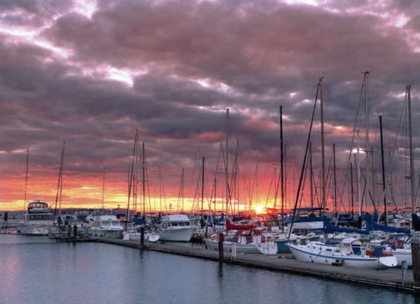 At the Everett Marina and waterfront, experience stunning sunsets, a variety of dining, and easy access to water activities on Puget Sound
